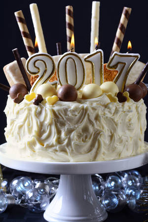 Festive holidays 2017 Happy New Year  centerpiece white chocolate cake with candy and cookies...