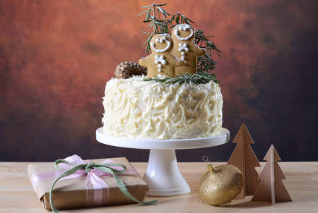 Festive holidays Christmas showstopper centerpiece white chocolate cake with gingerbread men...