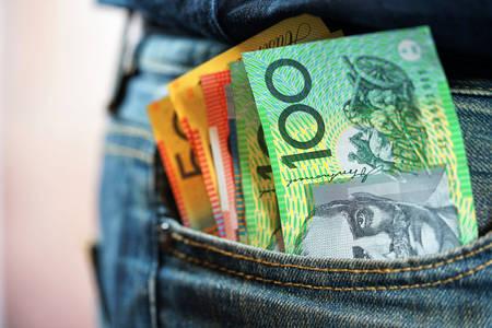 Australian cash money in mans jeans pocket, close up.の写真素材