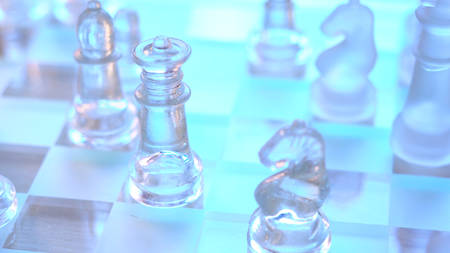 Chess game business concept with glass pieces in natural light, shallow DOF.の写真素材