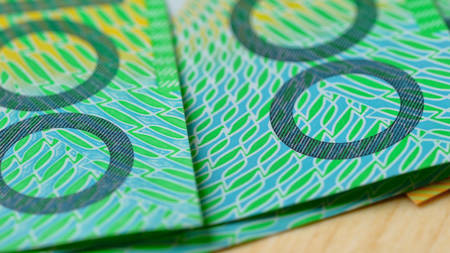 Macro closeup of Australian one hundred dollar notes, shallow dof.