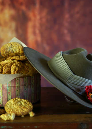 Traditional ANZAC biscuits for ANZAC Day and Remembrance Day in vintage style setting with Australian army slouch hat with copy space.の写真素材