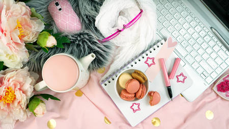 Flat lay working or studing from the cozy comfort of bed at home with touch screen laptop and...