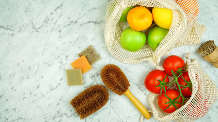 Zero-waste, plastic-free household flatlay overhead with coconut fiber, bamboo and reusable kitchen and food preparation products.の写真素材