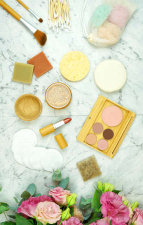 Zero-waste, plastic-free beauty and makeup flat lay overhead with coconut fiber, bamboo and reusable products.の写真素材