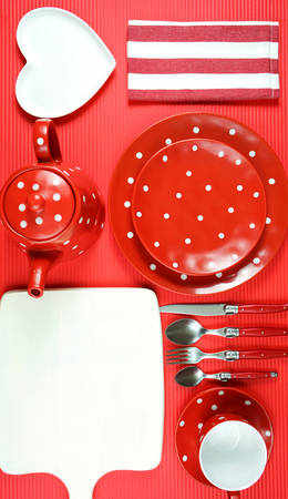 Modern bright colorful red theme morning breakfast or brunch table setting, flat lay.の写真素材