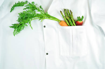 Healthy lifestyle, food is medicine, concept flatlay with fruit and vegetables in pocket of white...