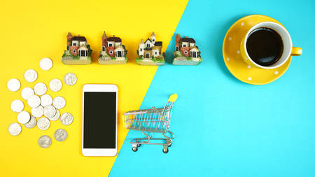 E-commerce real estate shopping, planning and financing for houses concept with miniature shopping...