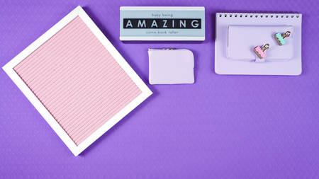 Back to school purple teens theme concept flat lay with pink notice board, stationery and...