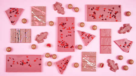 Ruby chocolate selection flat lay overhead on pink