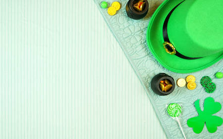 St Patricks Day flatlay with leprechaun hat, chocolate coins, with copy space.