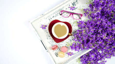 Vintage Springtime creative layout with lilac, coffee break with old books.