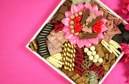 Chocolate dessert charcuterie grazing platter tray on modern pink background
