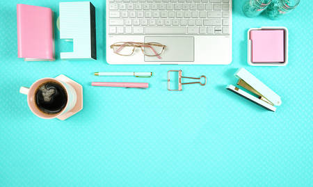 Desktop workspace with hi-tech laptop and modern colorful accessories.