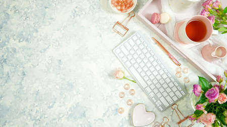 Blush pink cosy hygge style desktop workspace blog header overhead flat lay.の写真素材