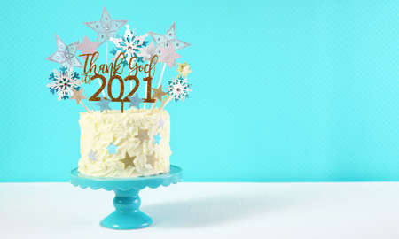 Happy New Years Eve cake with Thank God Its 2021 cake topper decoration.
