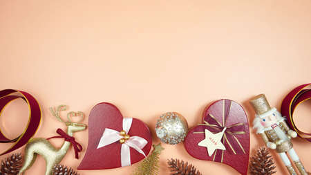 Luxury Christmas flatlay with stylish coral, red and gold gifts and decorations.の写真素材