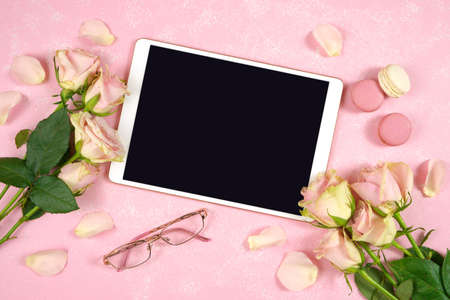 Desktop workspace tablet mockup flatlay, blush pink roses on pink background.の写真素材
