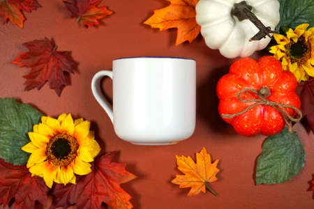 Autumn leaves and pumpkins theme product mockup flatlay on brown background