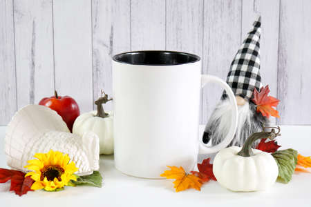 Halloween trick or treat product mockup with autumn leaves and white pumpkins.の写真素材