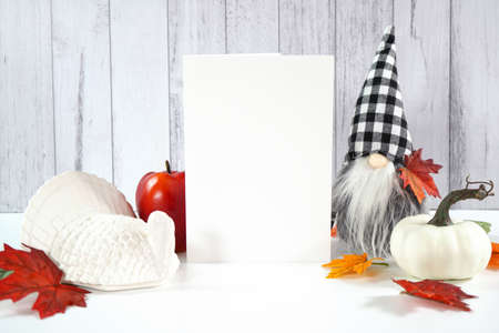 Halloween trick or treat product mockup with autumn leaves and white pumpkins.の写真素材