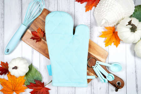 Halloween trick or treat product mockup with autumn leaves and white pumpkins.の写真素材