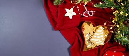 Cozy Christmas cookies and sweater creative concept layout flatlay.の写真素材