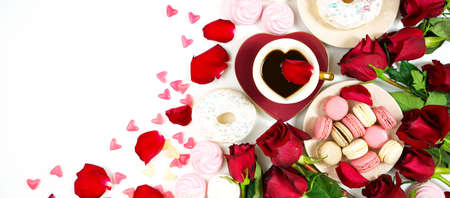 Red roses morning tea creative flat lay layout with coffee in heart shaped cupの写真素材