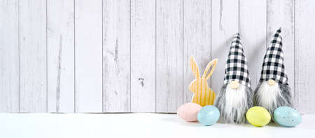 Easter farmhouse theme banner backdrop on white wood background.の写真素材