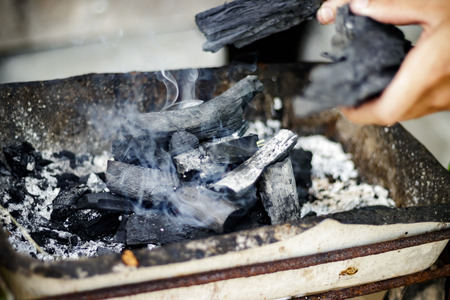 burning coals for grilling, White smokeの写真素材