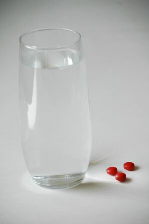 glass of water and pain relieverの写真素材