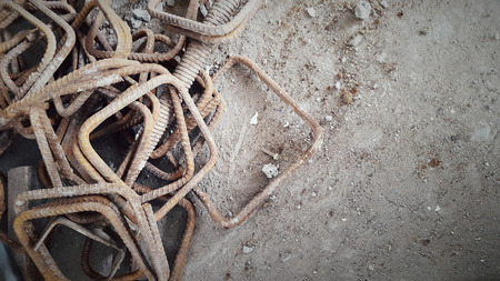 Rusty rebar steels are abandoned on the floorの写真素材