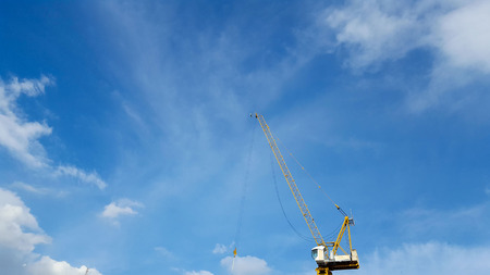 The construction crane high to the skyの写真素材