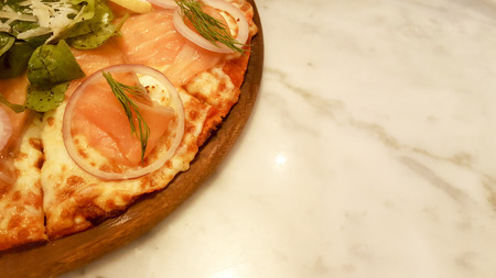 Smoked Salmon pizza plate on tableの写真素材