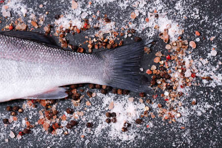 fish tail on a wooden boardの写真素材