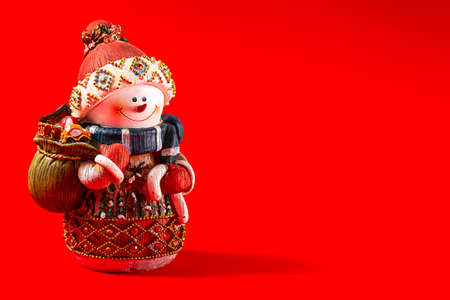 Christmas toys, snowman, Happy New Year 2021, Merry Christmas, on a red blackground, horizontalの写真素材