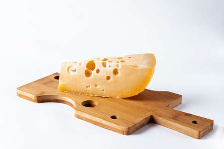 hole cheese triangle, cheese cutting board, on white bacgroundの写真素材