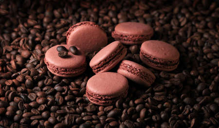 chocolate french cakes, macarons, on a coffee beans, wallpaper, horizontalの写真素材
