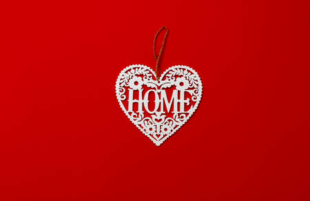 plywood topper, white heart on a red background, top view, inscription Home, horizontalの写真素材