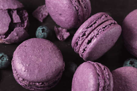 blueberry macaroons, on black background, view from above