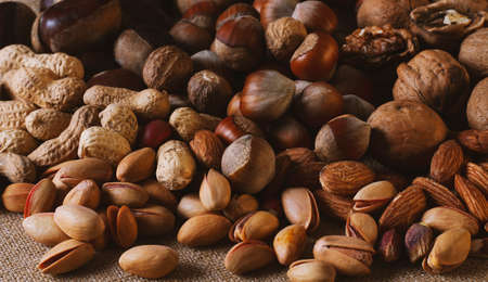 assortment of nuts, walnuts, hazelnuts, peanuts, almonds, chestnut pistachiosの写真素材