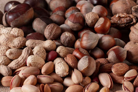 assortment of nuts, walnuts, hazelnuts, peanuts, almonds, chestnut pistachiosの写真素材