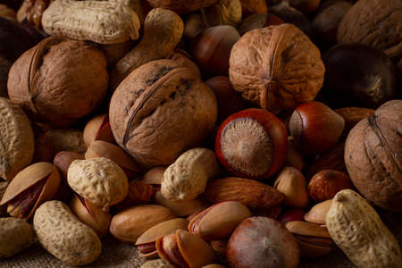 assortment of nuts, walnuts, hazelnuts, peanuts, almonds, chestnut pistachiosの写真素材