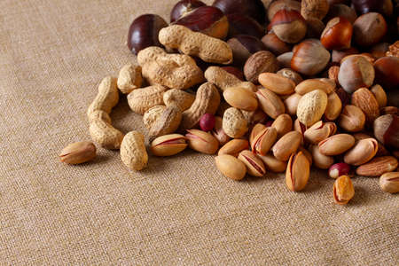assortment of nuts, walnuts, hazelnuts, peanuts, almonds, chestnut pistachiosの写真素材