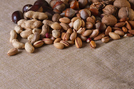assortment of nuts, walnuts, hazelnuts, peanuts, almonds, chestnut pistachiosの写真素材