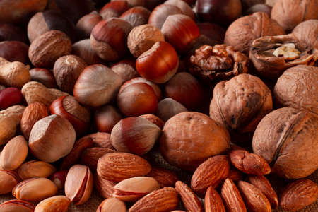 assortment of nuts, walnuts, hazelnuts, peanuts, almonds, chestnut pistachiosの写真素材