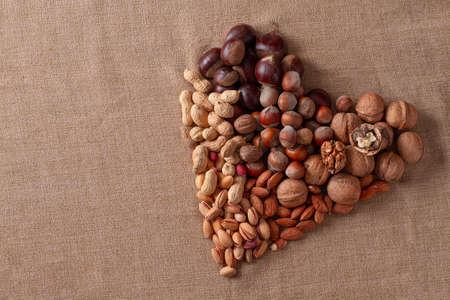 assortment of nuts, walnuts, hazelnuts, peanuts, almonds, chestnut pistachiosの写真素材