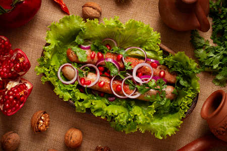 fried sausages, with herbs and spices, top view