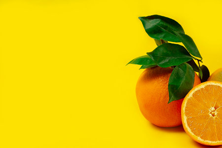 Orange with leaves, fruit,on a orange background, top view, no people, horizontal,