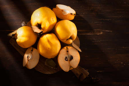 Quince fruit, on a wooden table, horizontal,rustic, no people,の写真素材